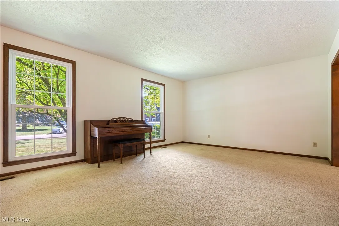 This is a living room off the foyer.  This is another large living room space.