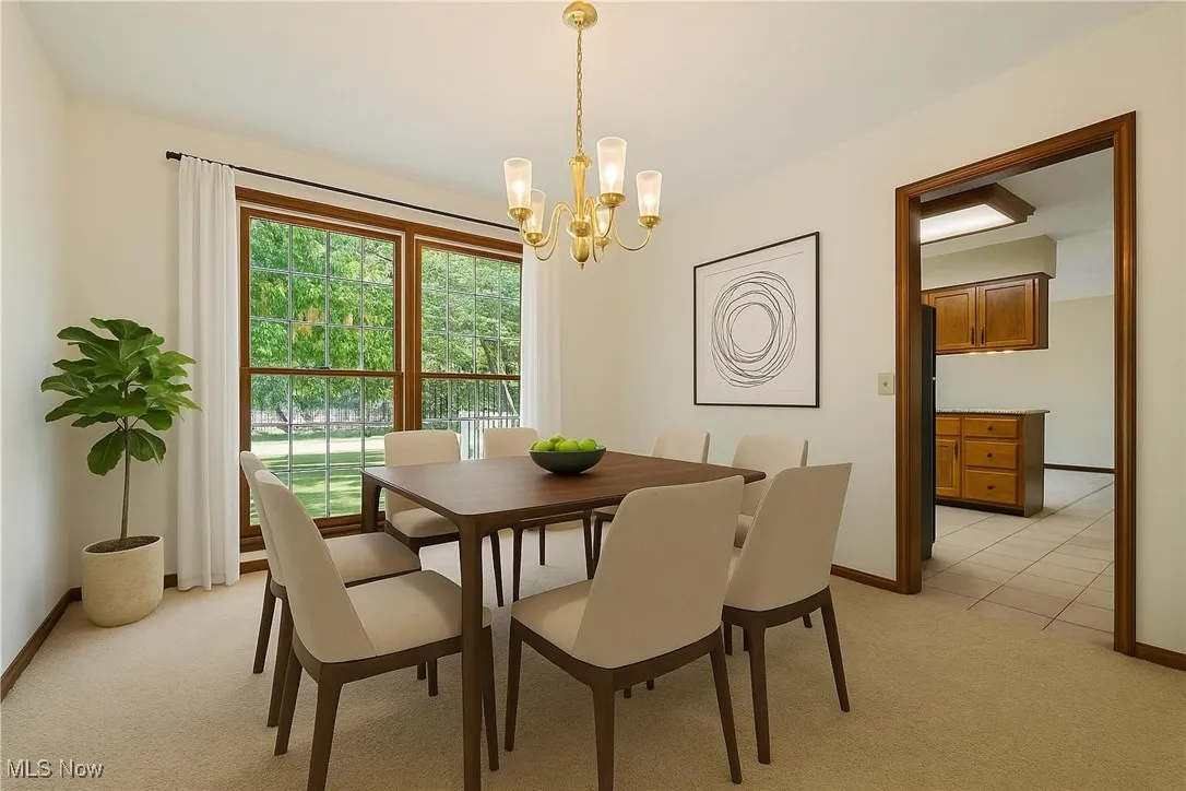 This is the dining room.  This is a virtually staged room so you can see how it would flow with the kitchen.  This room has a great deal of natural light.