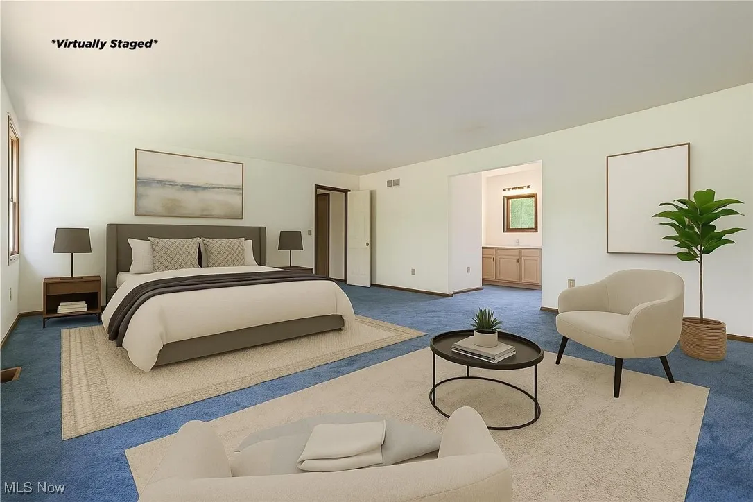 This is a virtually staged photo.   We wanted you to see how large this bedroom is and the options available to you for decorating.