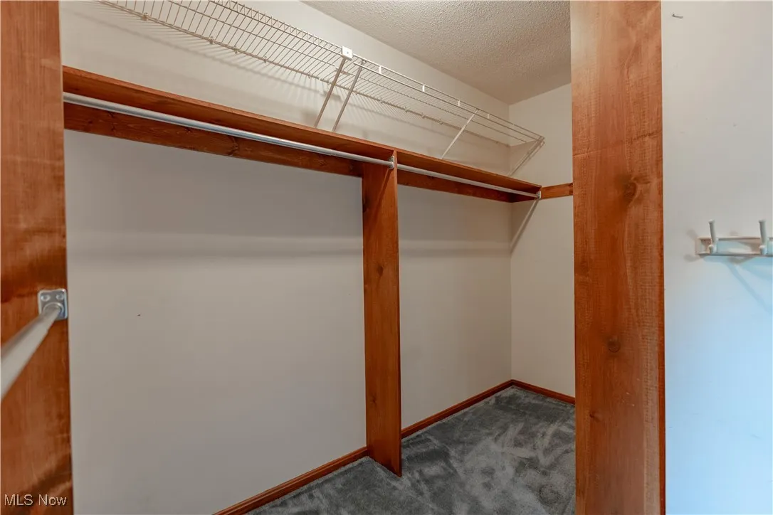 View of the large walk in closet for the primary suite.