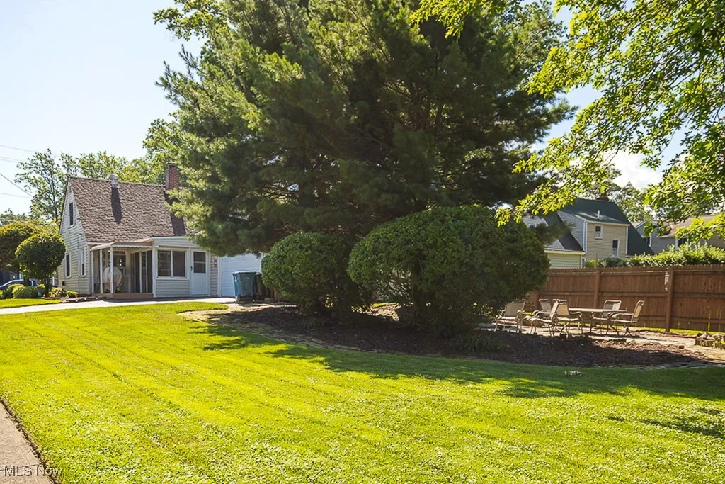 View of yard featuring a sunroom