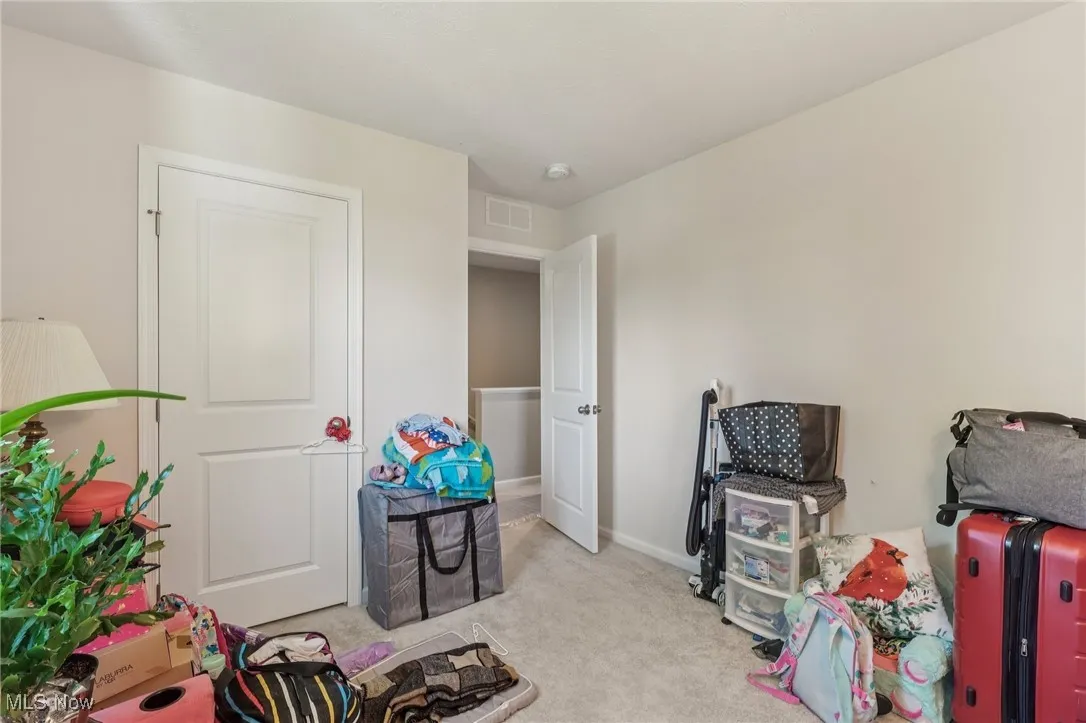 Recreation room featuring carpet and baseboards
