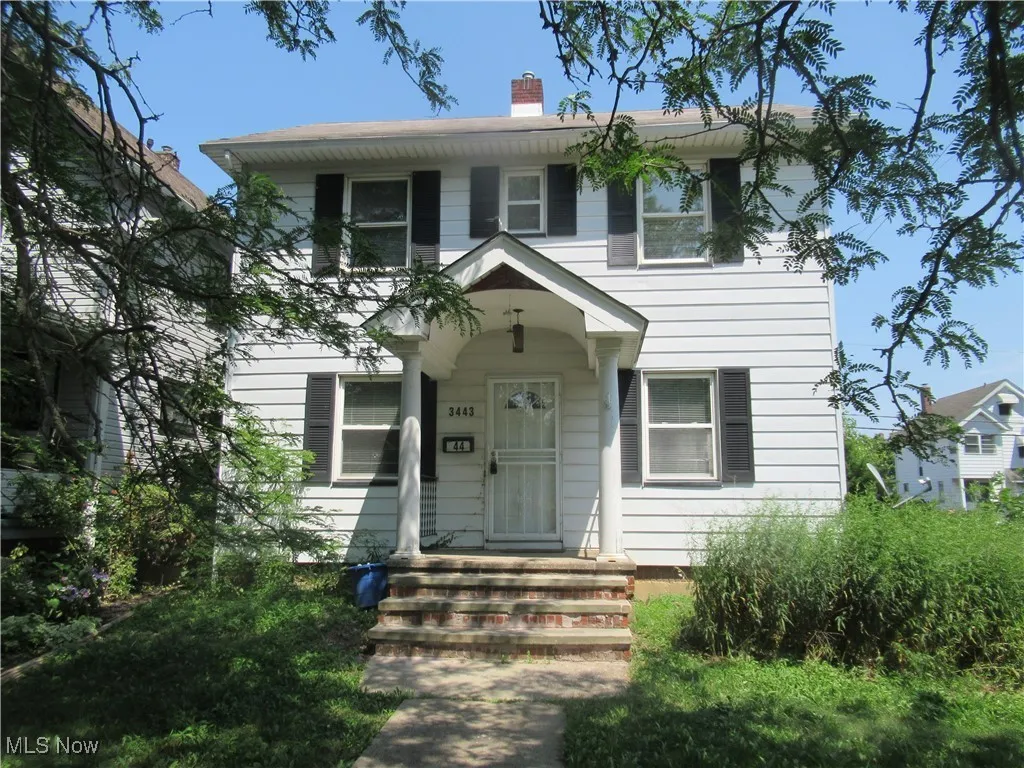 View of front of property featuring a chimney
