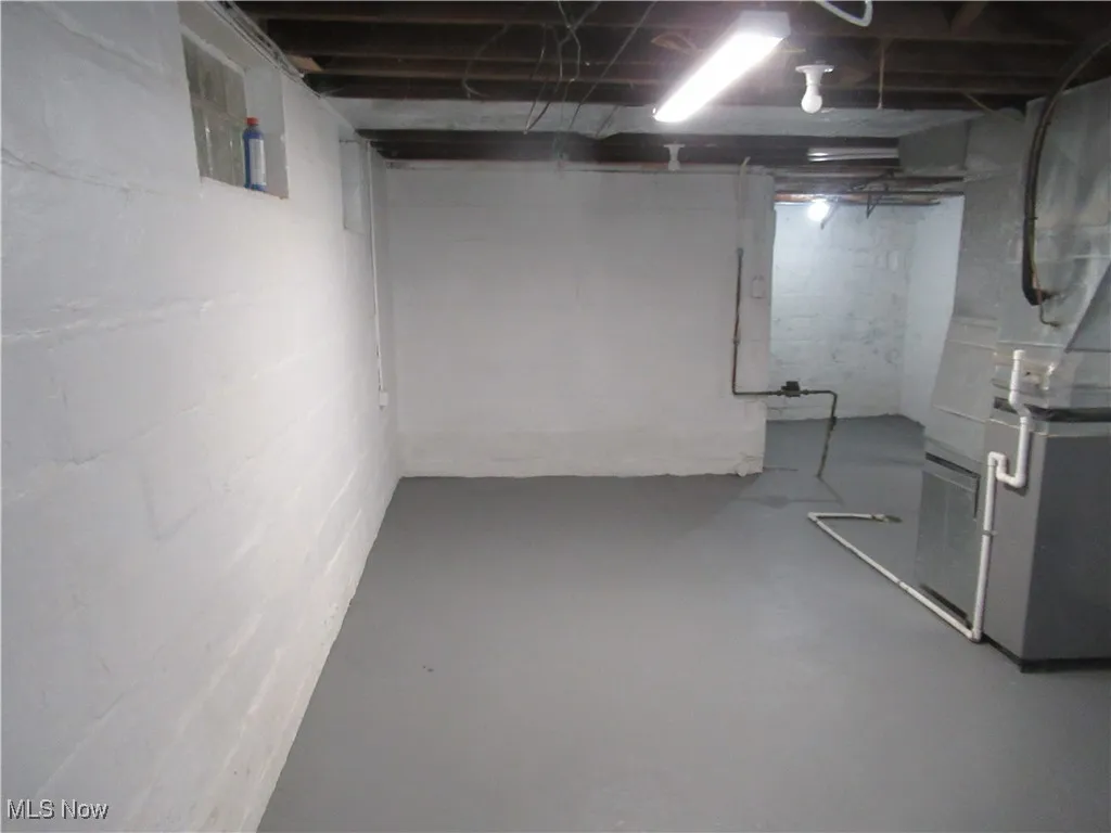 Unfinished below grade area with heating unit