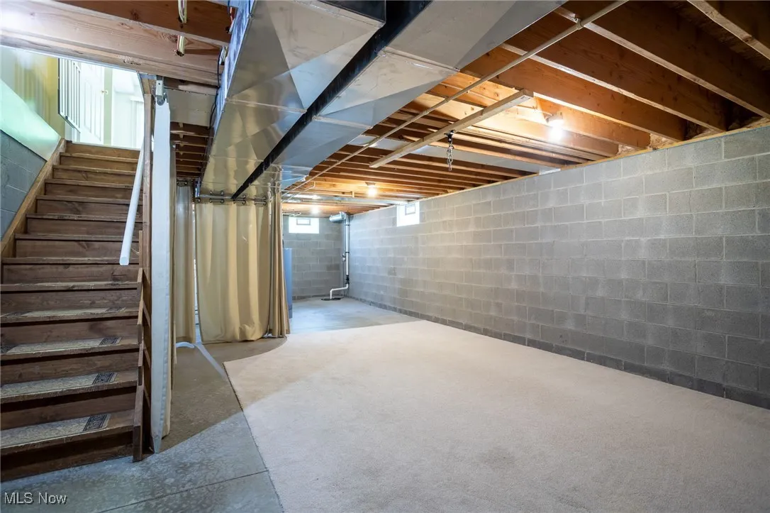 Below grade area featuring stairway