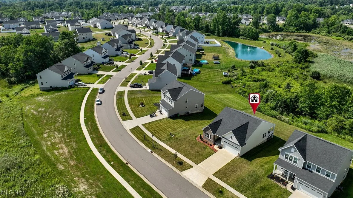 Aerial perspective of suburban area with a nearby body of water
