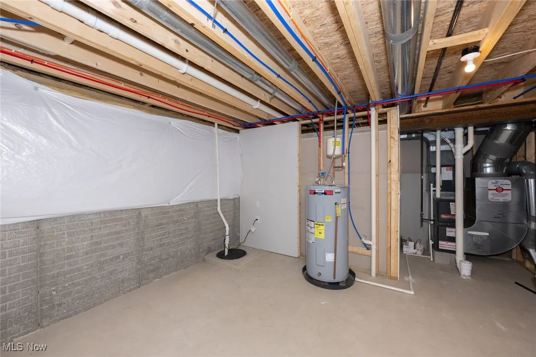 Unfinished basement with water heater and heating unit