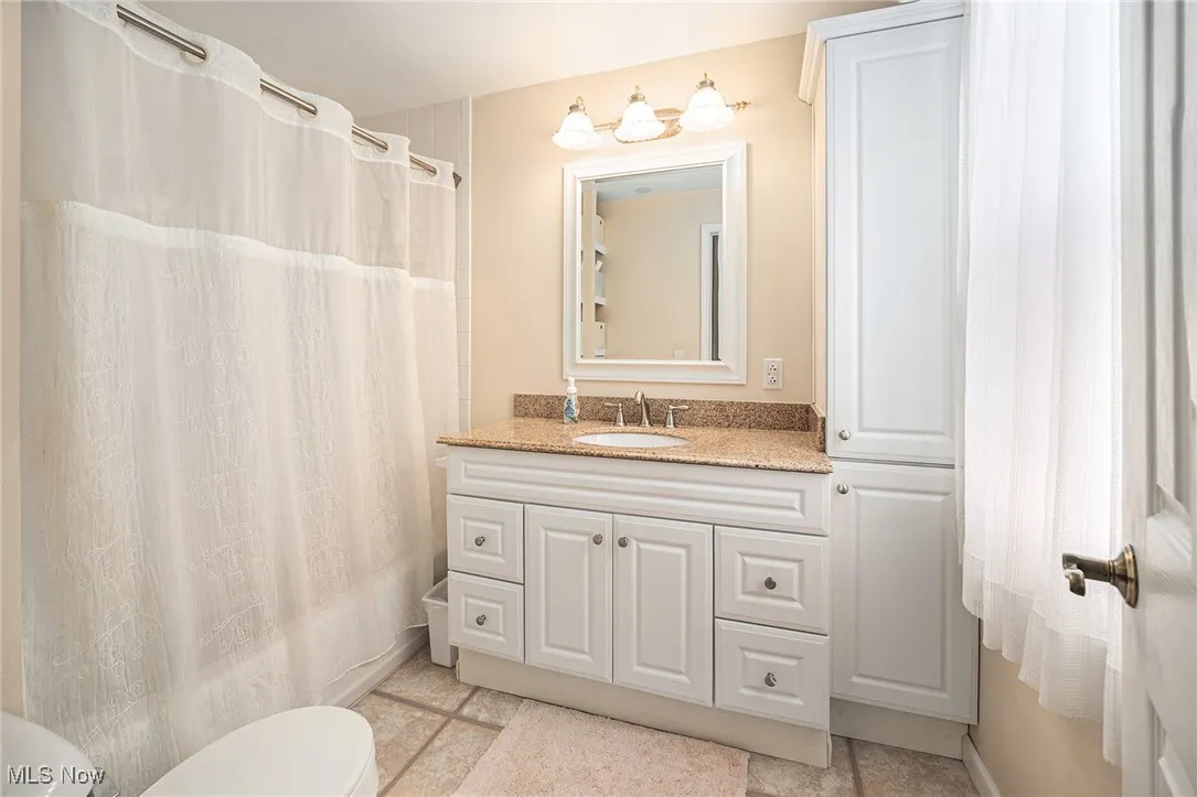 Bathroom with toilet and vanity