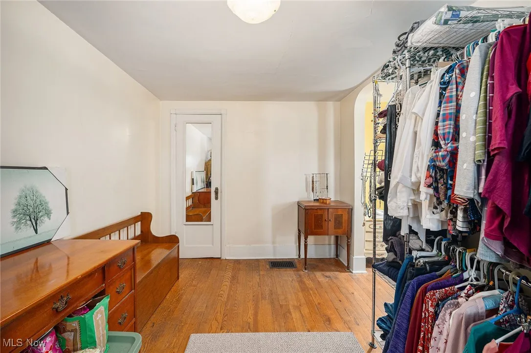Walk in closet featuring hardwood / wood-style flooring