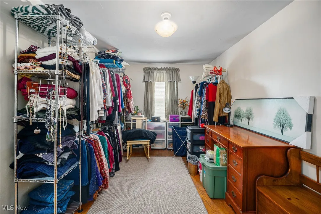 Spacious closet with wood finished floors