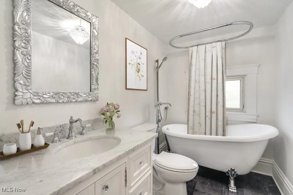 Bathroom featuring a freestanding tub and vanity