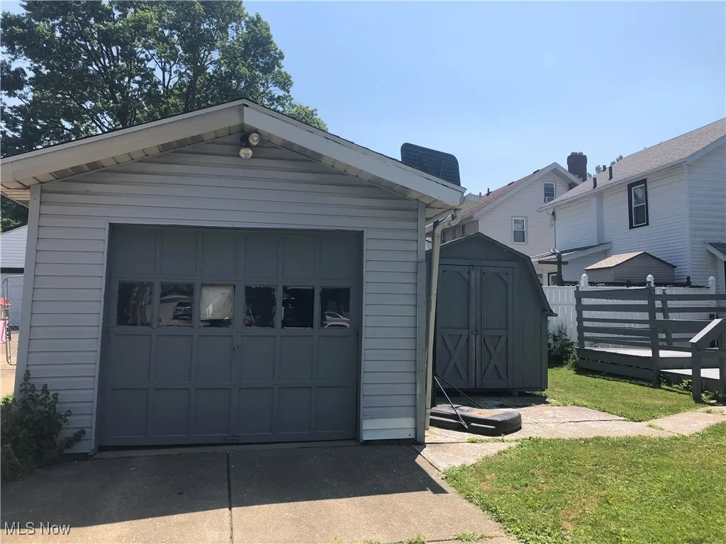 Detached garage featuring driveway