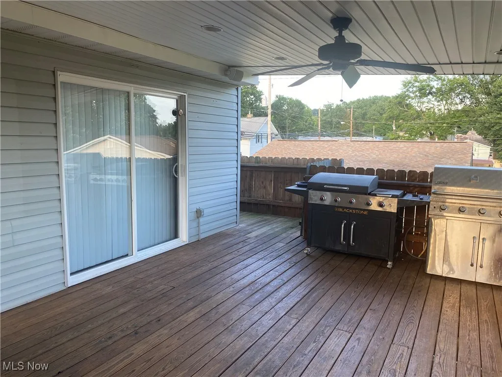 Covered deck with 2 gas grill hookups and a TV mount