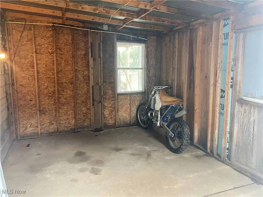 Lawncare shed connected to Garage