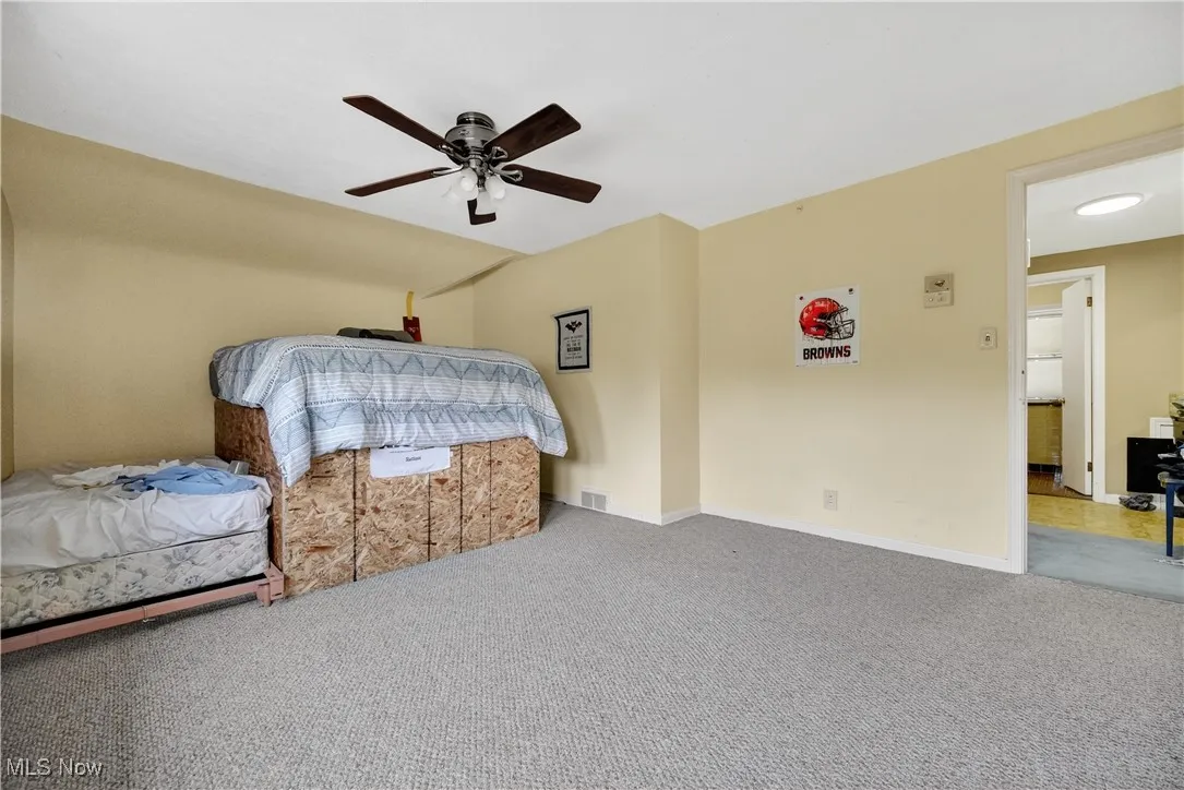 Bedroom featuring carpet flooring and a ceiling fan