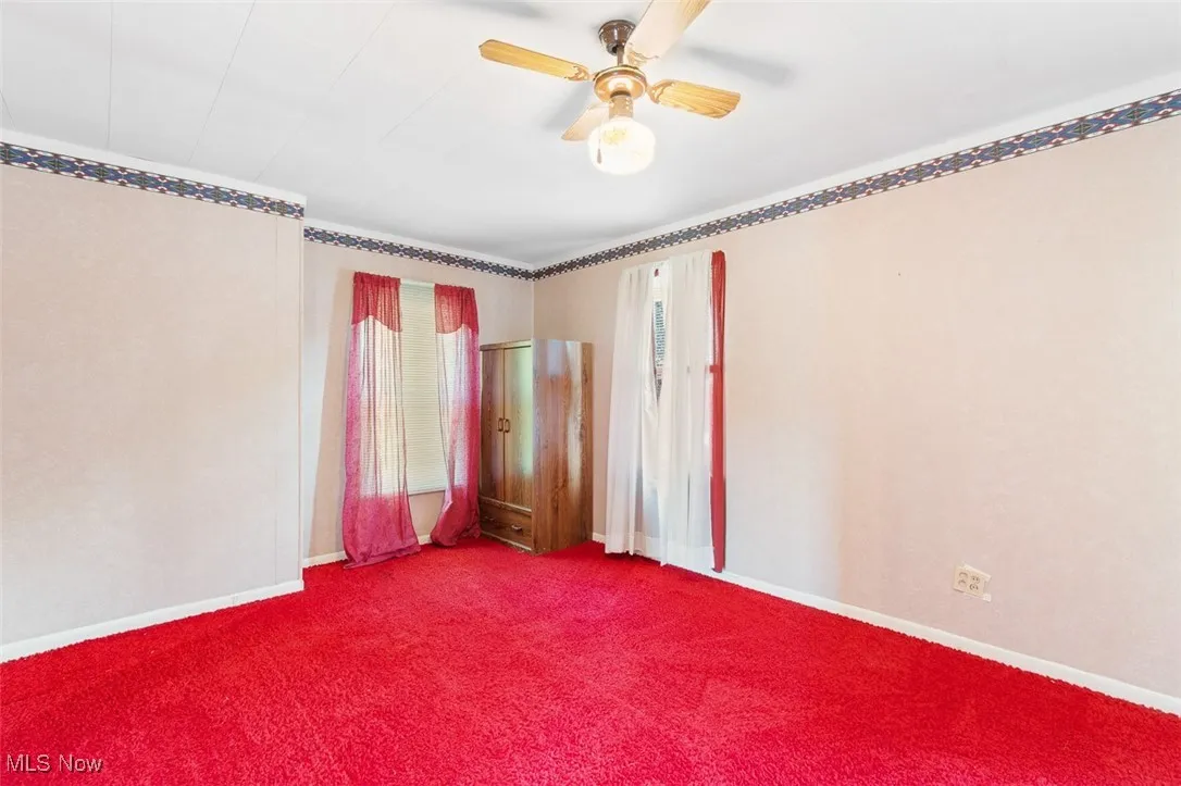 Bedroom featuring carpet flooring and ceiling fan
