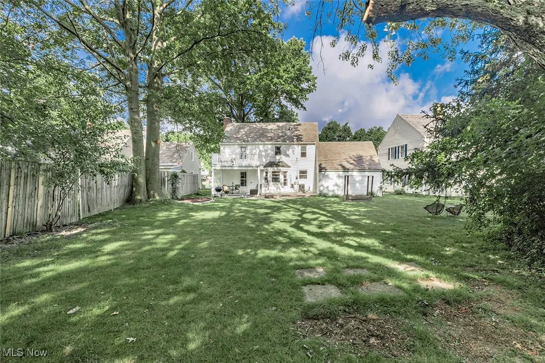 Fenced backyard featuring a patio