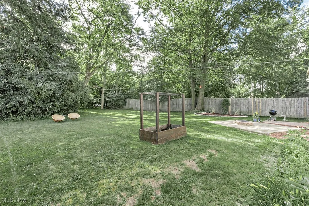 Fenced backyard featuring a patio