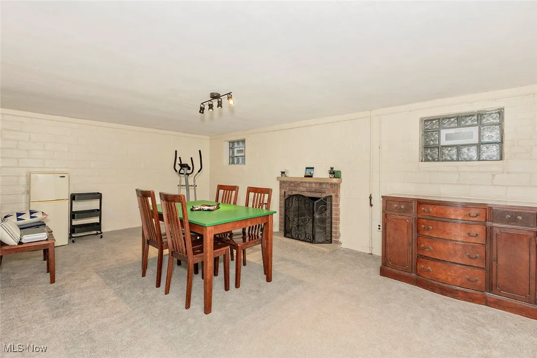 Finished basement featuring light carpet