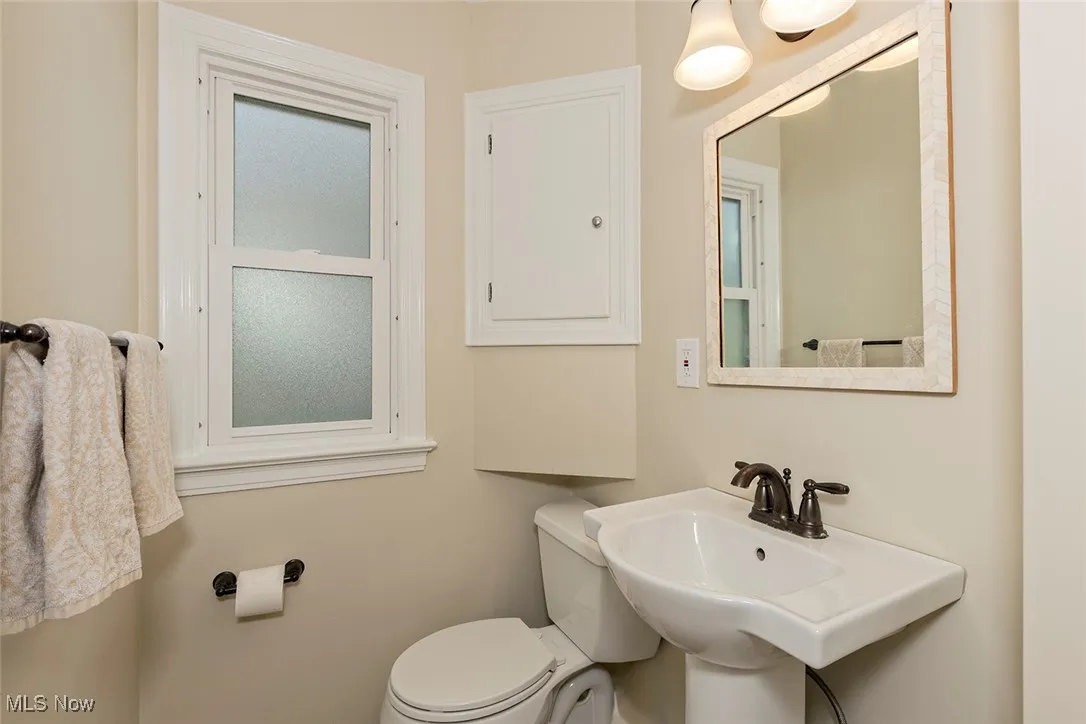 Bathroom featuring toilet and a sink