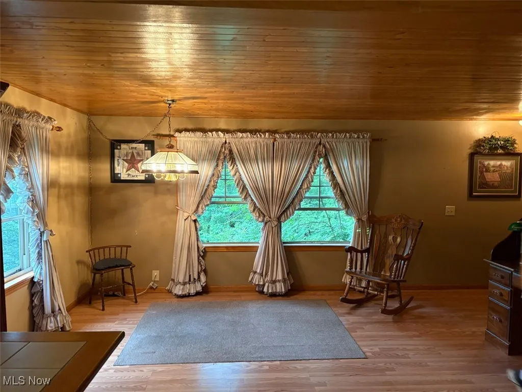 Dining area featuring wood finished floors and wood ceiling