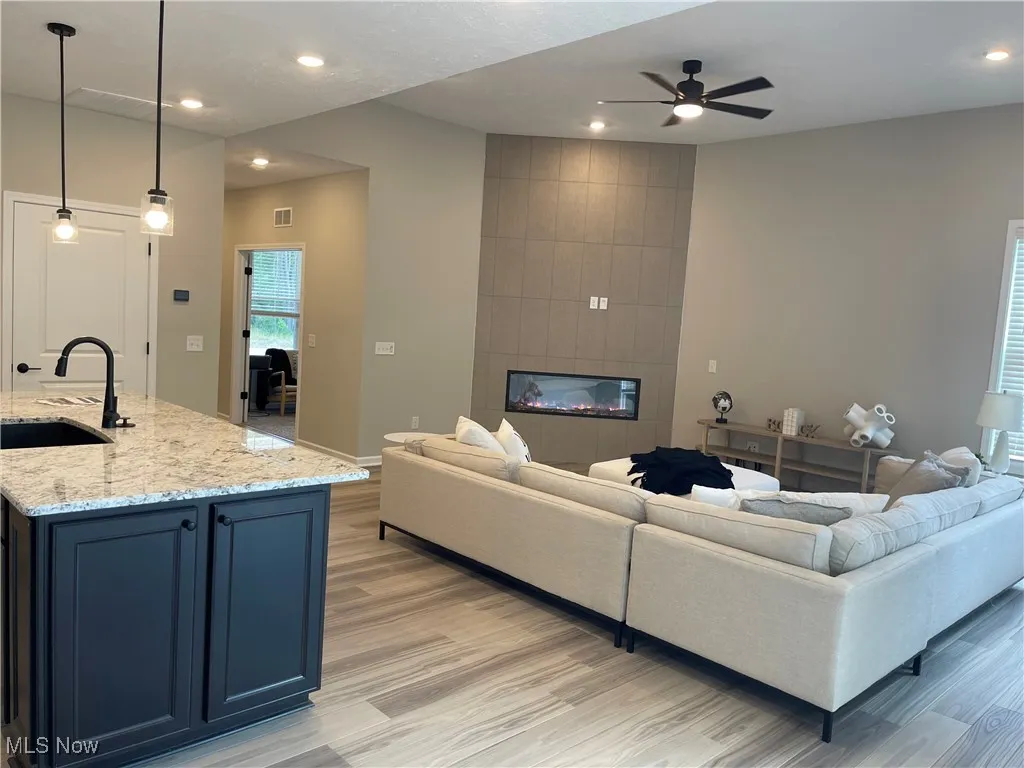 A stylish corner fireplace is the focal point of the gathering room.