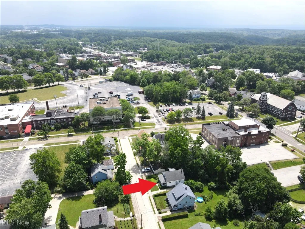 Aerial view of residential area with a forest