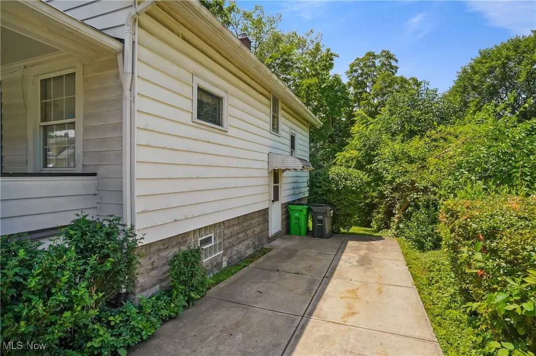 View of property exterior with a patio