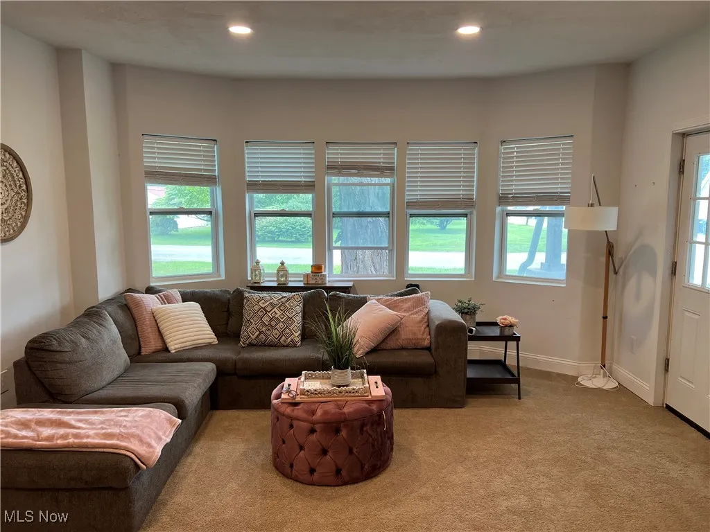 Living room with carpet floors and recessed lighting