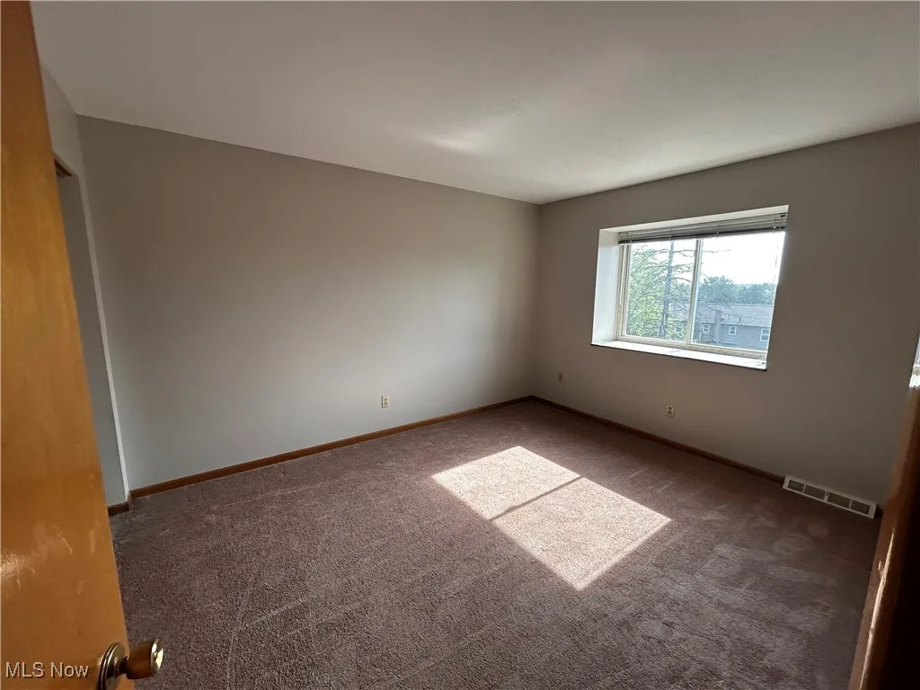 Spare room with carpet floors