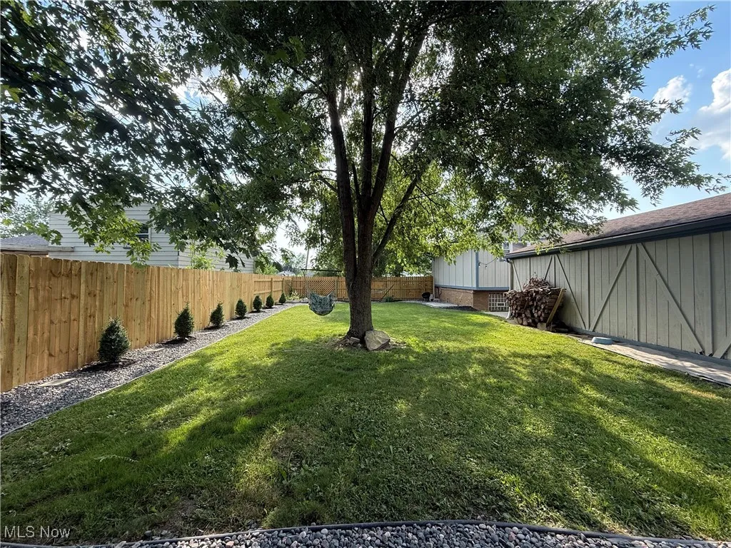 View of fenced backyard