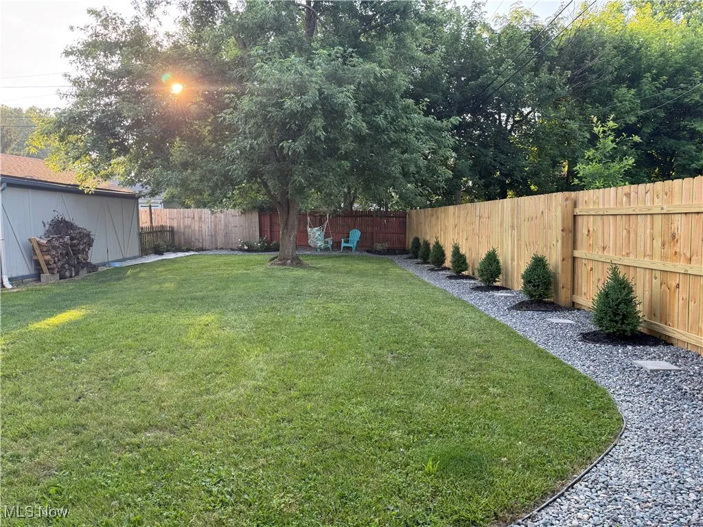 View of fenced backyard