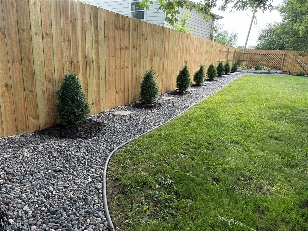 View of fenced backyard