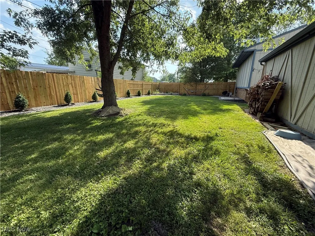 View of fenced backyard