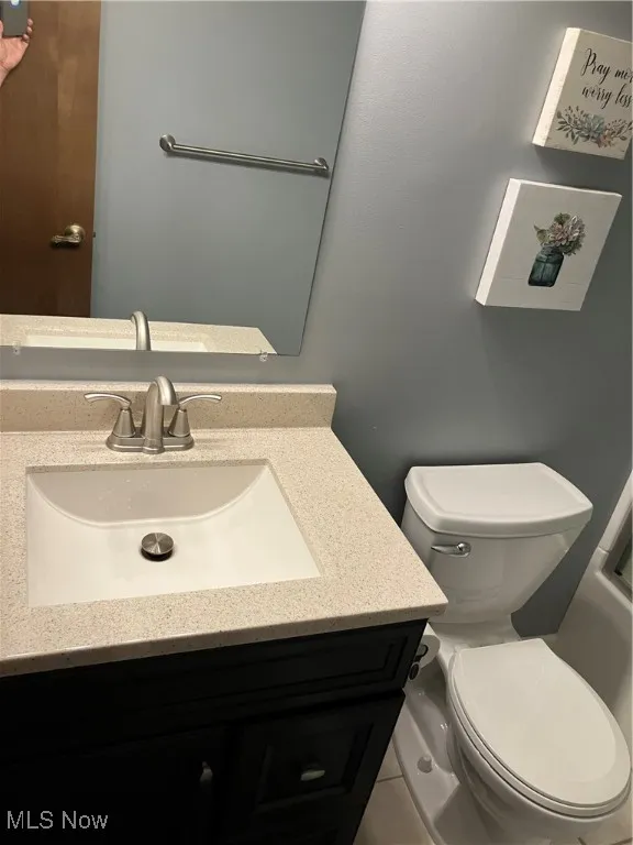 Bathroom featuring vanity and toilet
