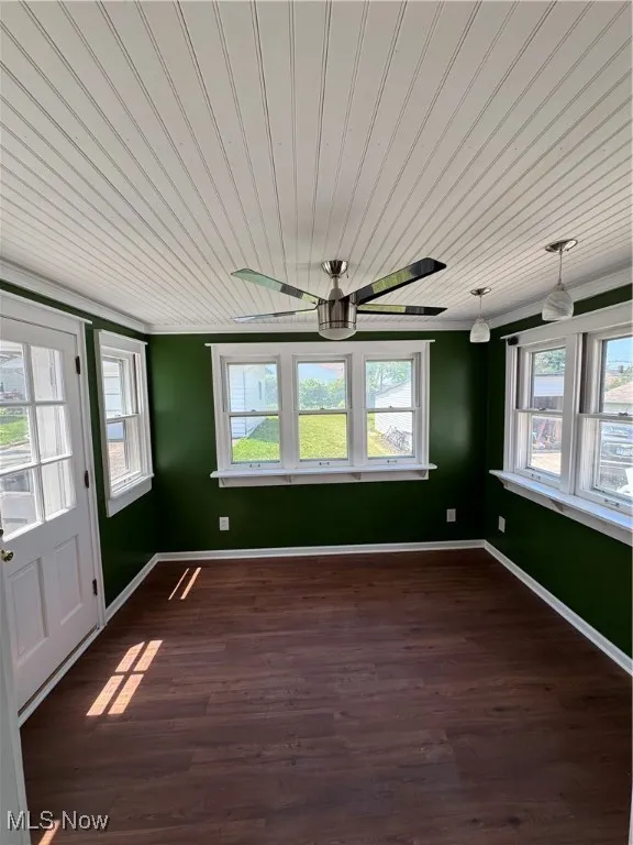 Morning room featuring wooden ceiling, ceiling fan, and dark wood finished floors