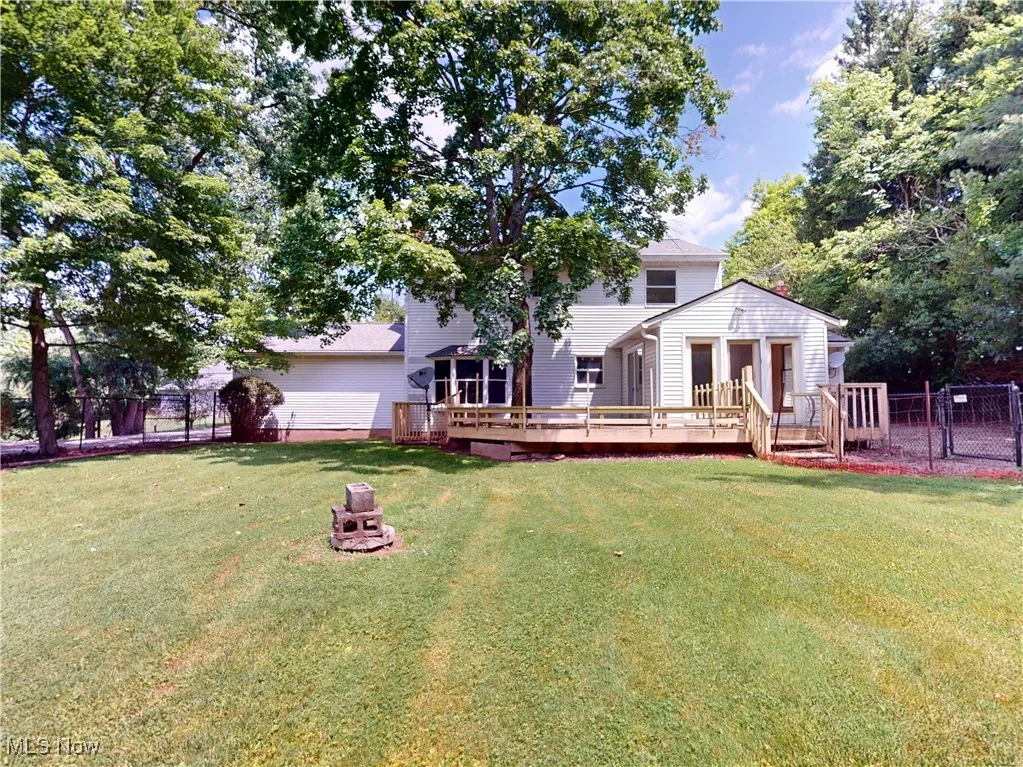 Back of property featuring a deck