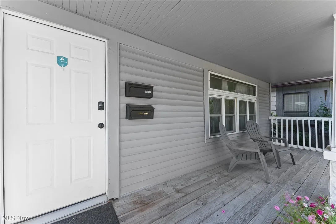View of exterior entry featuring a porch