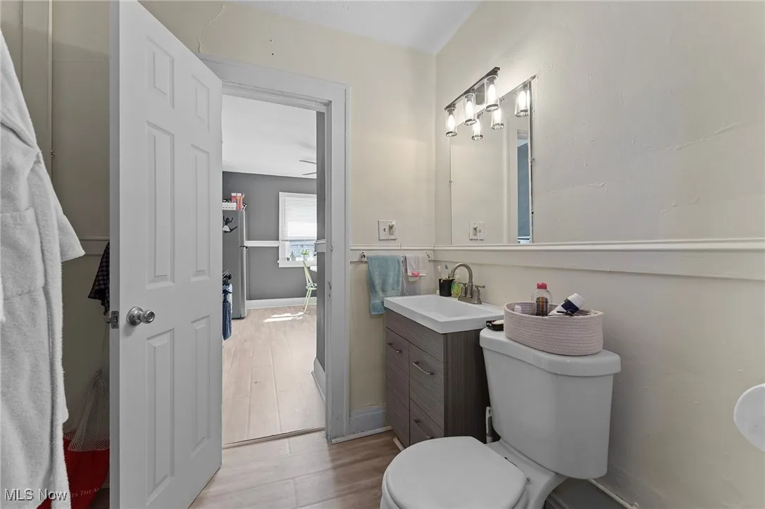 Bathroom with vanity and wood finished floors