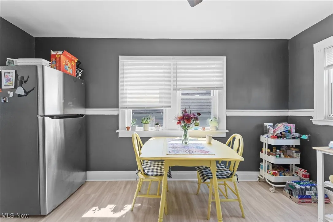 Dining room featuring wood finished floors and baseboards
