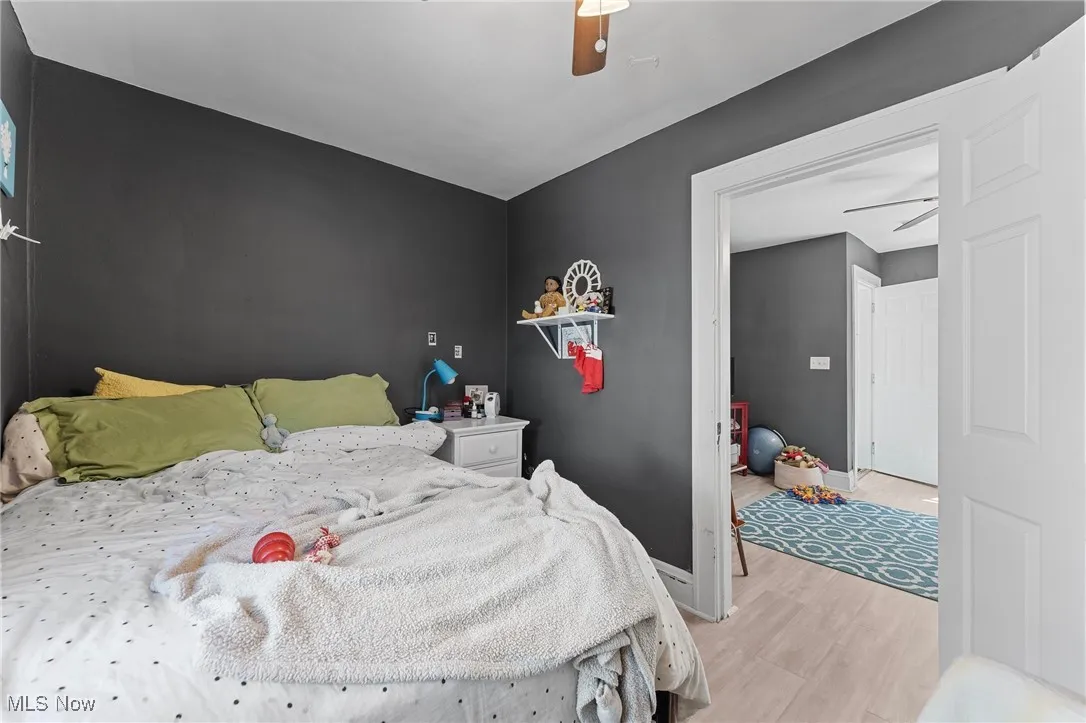 Bedroom featuring light wood-style floors and a ceiling fan