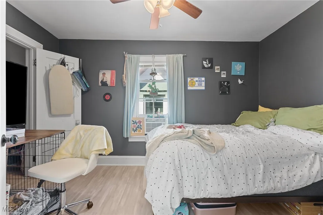 Bedroom featuring wood finished floors and a ceiling fan