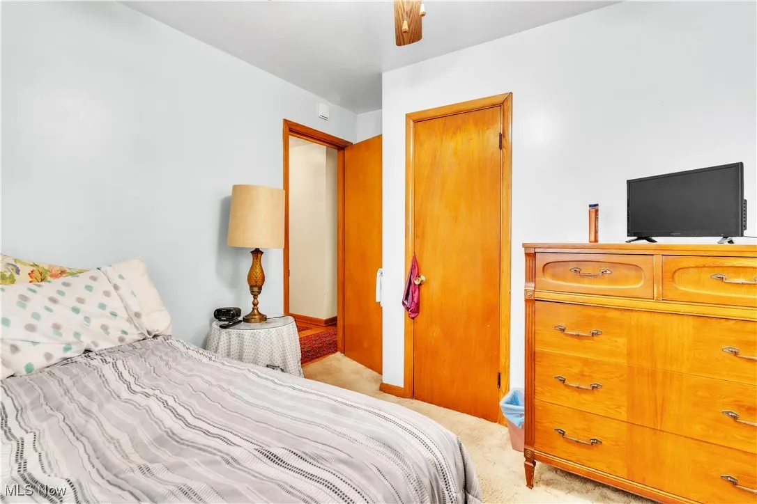 Bedroom featuring light colored carpet