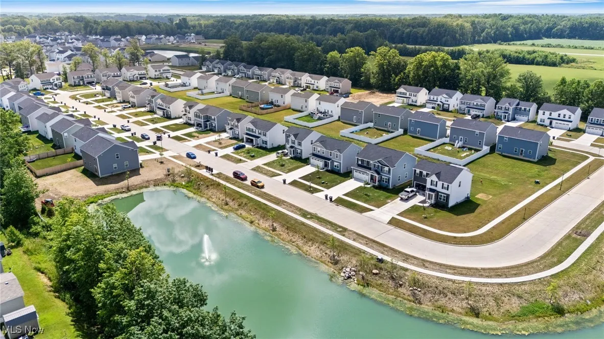 Aerial perspective of suburban area with a large body of water
