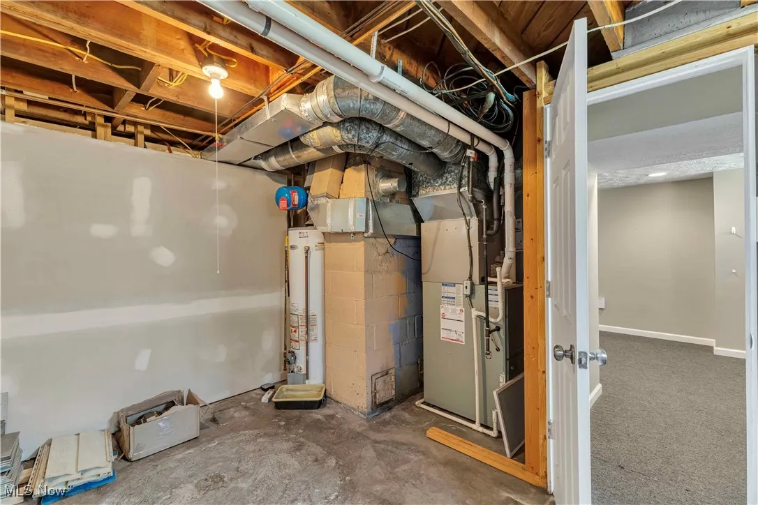 Unfinished basement with gas water heater