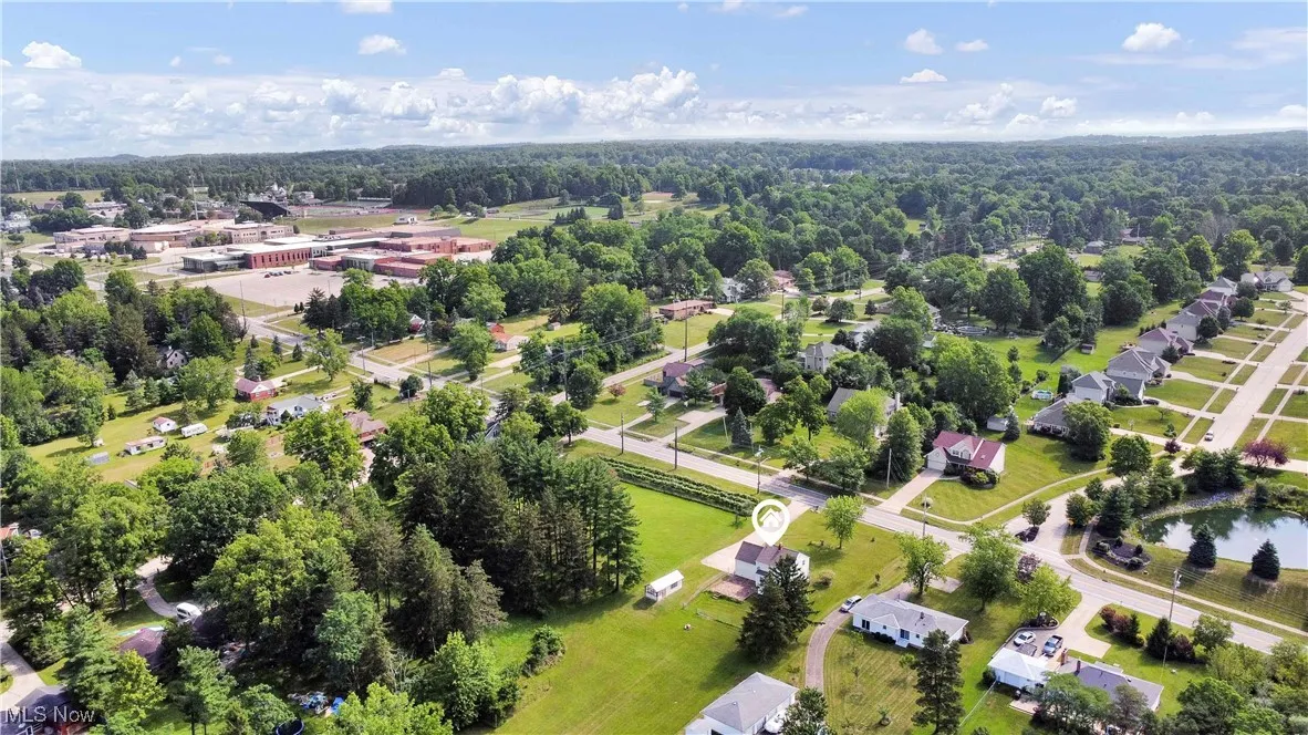 View of property location with a forest