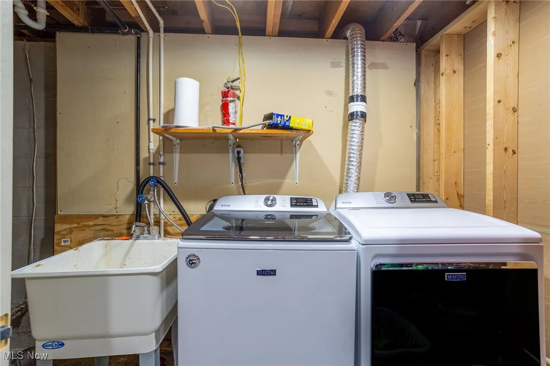 Laundry area featuring separate washer and dryer