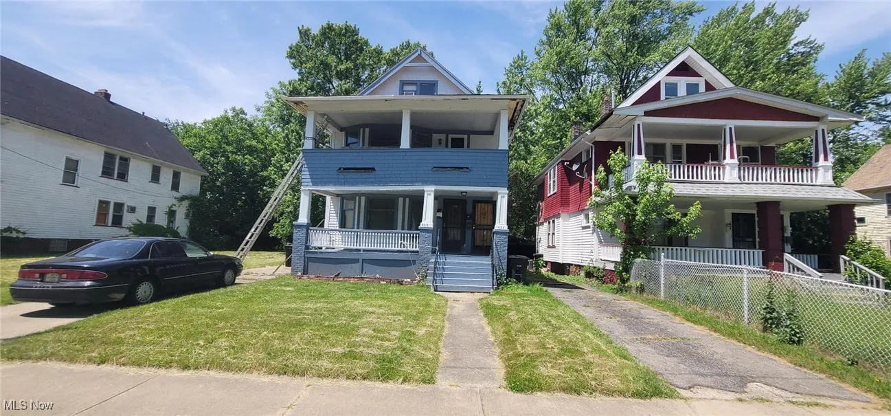 View of front facade featuring covered porch and a balcony