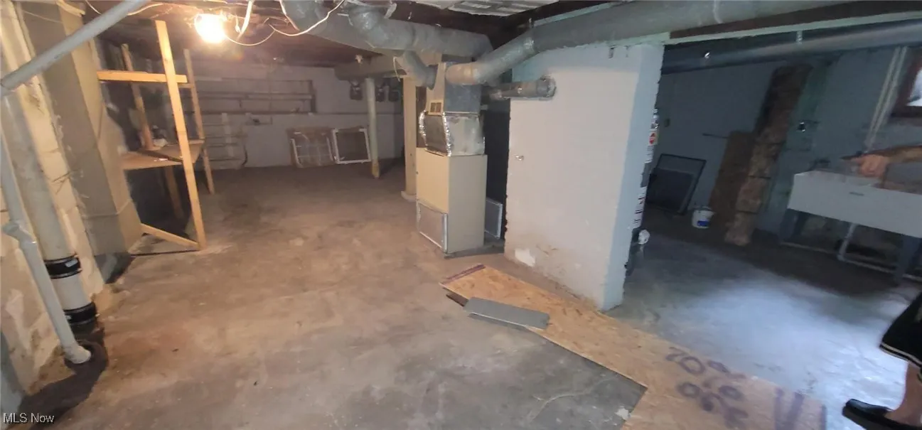 Unfinished below grade area with heating unit