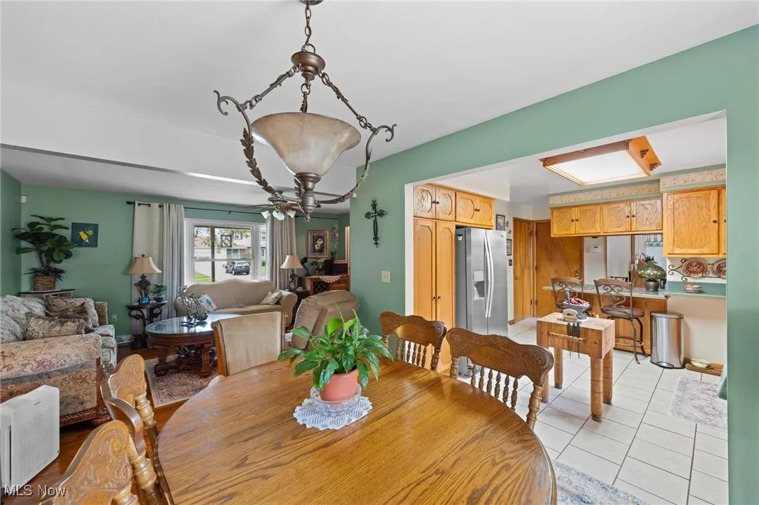 Dining room with light tile patterned flooring